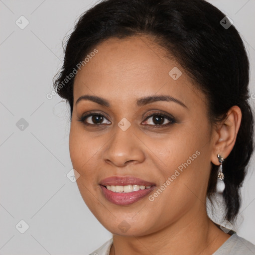 Joyful latino young-adult female with medium  brown hair and brown eyes