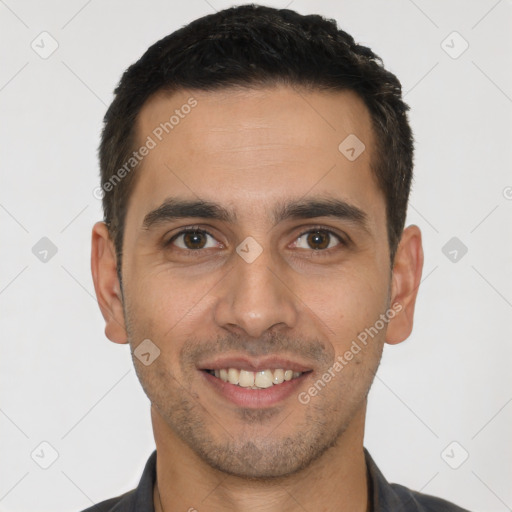 Joyful white young-adult male with short  brown hair and brown eyes