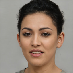 Joyful latino young-adult female with short  brown hair and brown eyes