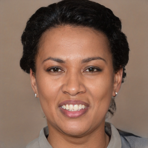Joyful latino young-adult female with short  brown hair and brown eyes