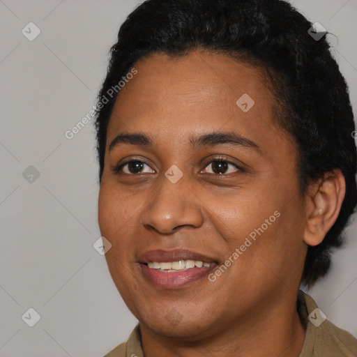 Joyful black young-adult female with short  brown hair and brown eyes
