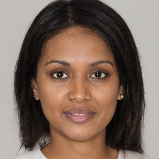 Joyful asian young-adult female with medium  brown hair and brown eyes