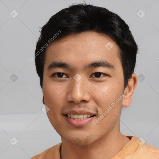 Joyful asian young-adult male with short  black hair and brown eyes