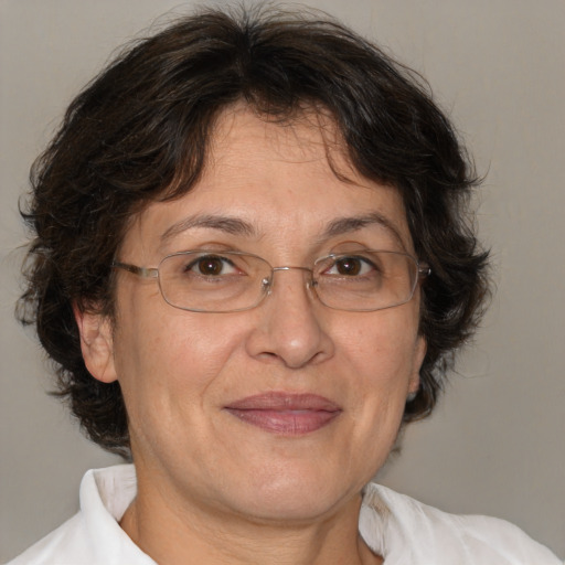 Joyful white middle-aged female with medium  brown hair and brown eyes