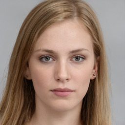 Neutral white young-adult female with long  brown hair and brown eyes