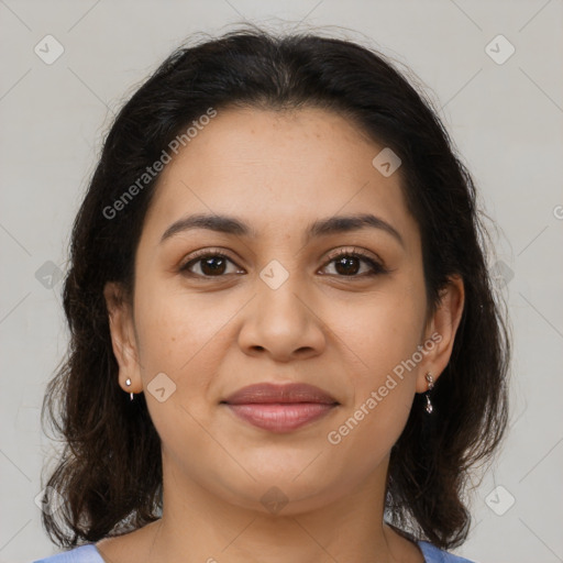 Joyful latino young-adult female with medium  brown hair and brown eyes