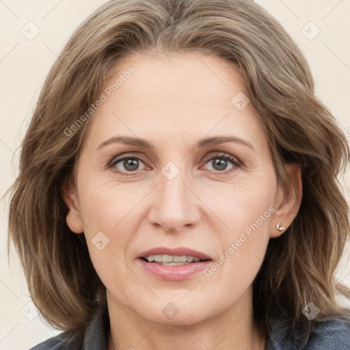 Joyful white adult female with medium  brown hair and grey eyes