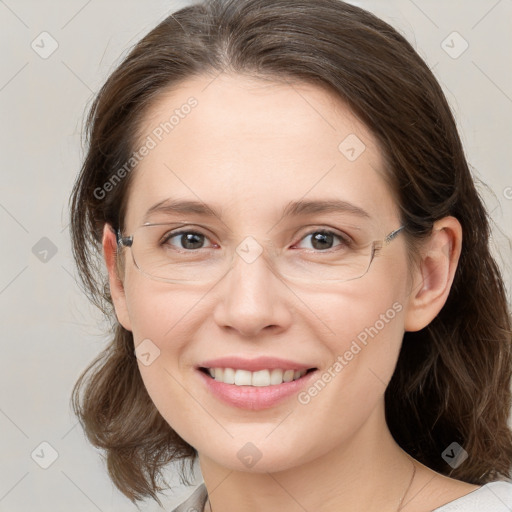 Joyful white young-adult female with medium  brown hair and grey eyes