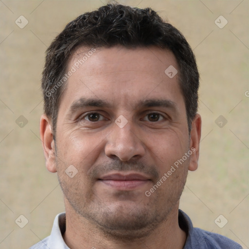 Joyful white adult male with short  brown hair and brown eyes