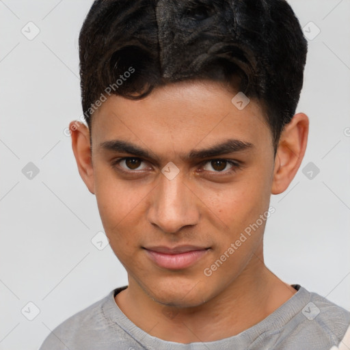 Joyful latino young-adult male with short  brown hair and brown eyes