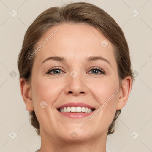 Joyful white adult female with medium  brown hair and grey eyes