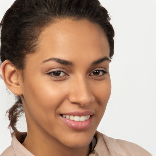 Joyful latino young-adult female with short  brown hair and brown eyes