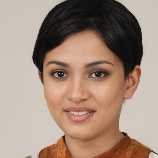 Joyful asian young-adult female with short  brown hair and brown eyes