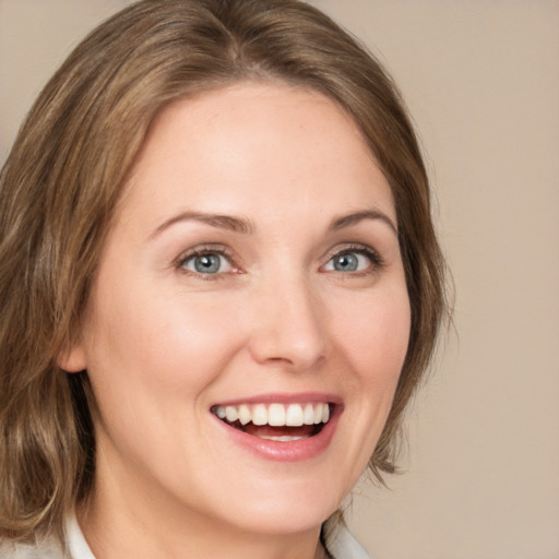 Joyful white young-adult female with medium  brown hair and blue eyes