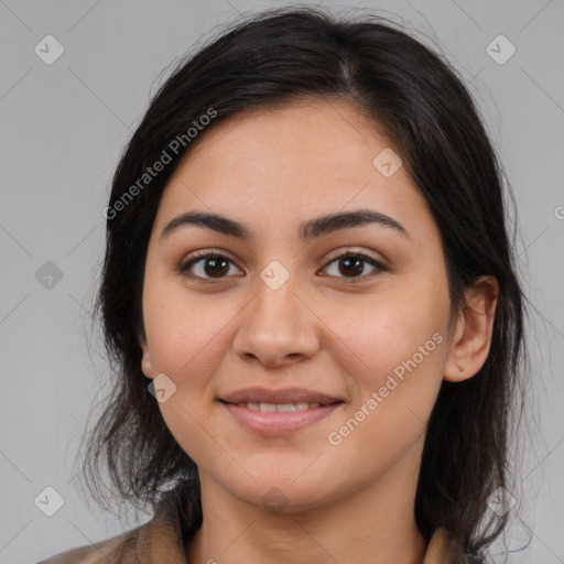 Joyful latino young-adult female with medium  brown hair and brown eyes