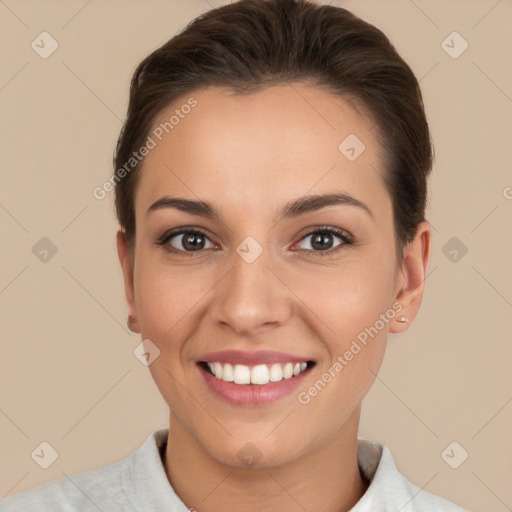 Joyful white young-adult female with short  brown hair and brown eyes