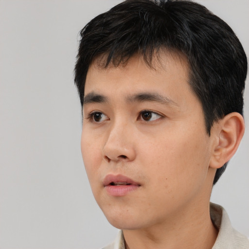 Neutral asian young-adult male with short  black hair and brown eyes