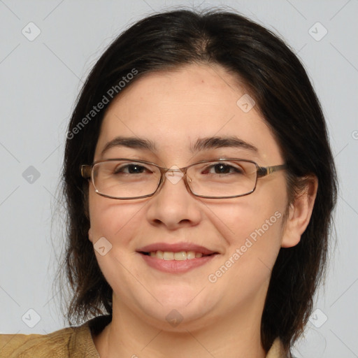 Joyful white adult female with medium  brown hair and brown eyes