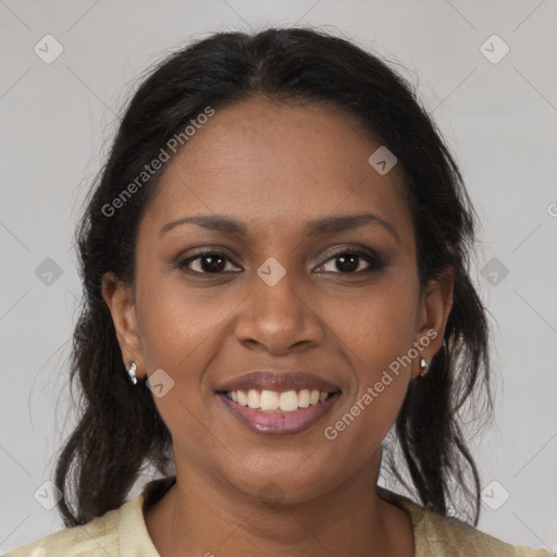 Joyful black young-adult female with medium  brown hair and brown eyes