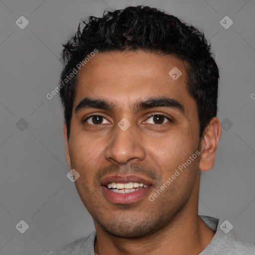 Joyful latino young-adult male with short  black hair and brown eyes