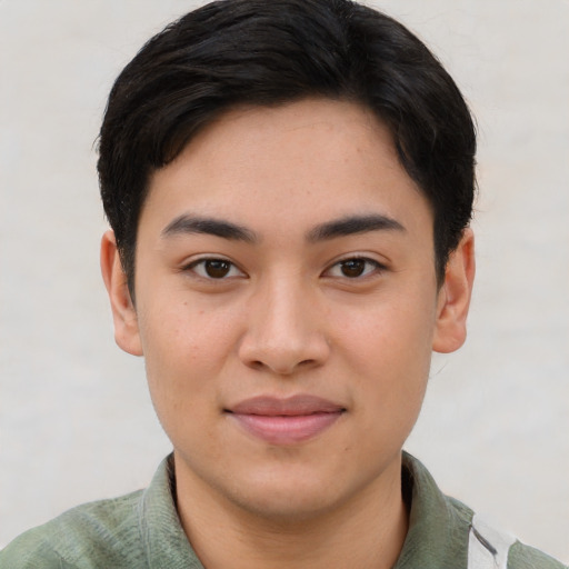 Joyful asian young-adult male with short  brown hair and brown eyes