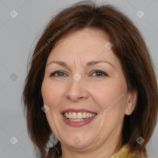 Joyful white adult female with medium  brown hair and brown eyes