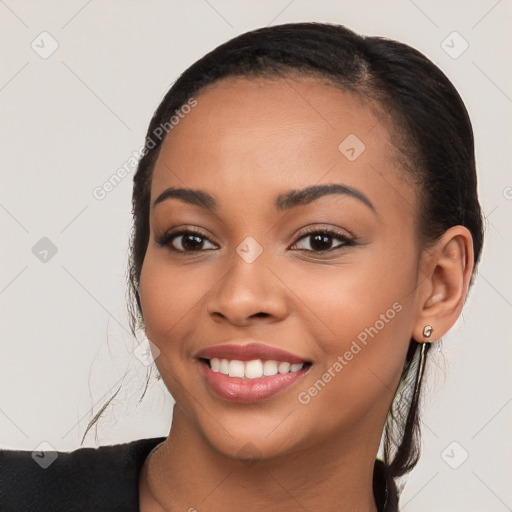 Joyful latino young-adult female with long  brown hair and brown eyes