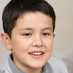 Joyful white child male with short  brown hair and brown eyes