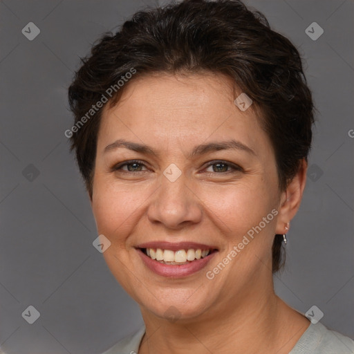 Joyful white adult female with short  brown hair and brown eyes