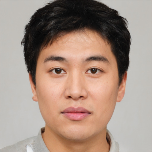 Neutral asian young-adult male with short  brown hair and brown eyes