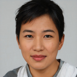 Joyful asian young-adult female with short  black hair and brown eyes