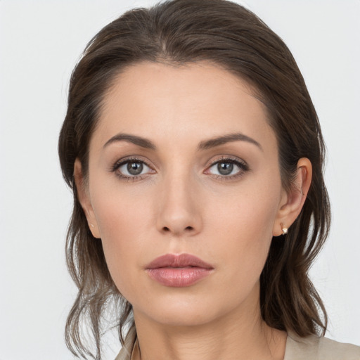 Neutral white young-adult female with medium  brown hair and grey eyes