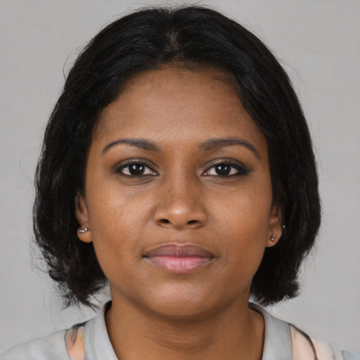Neutral black young-adult female with medium  black hair and brown eyes