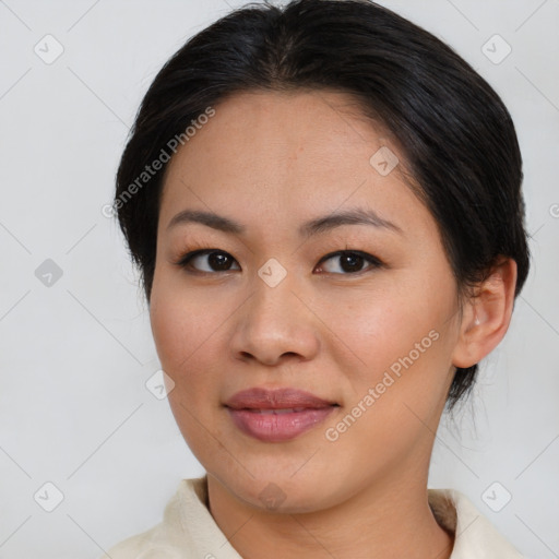 Joyful asian young-adult female with medium  brown hair and brown eyes