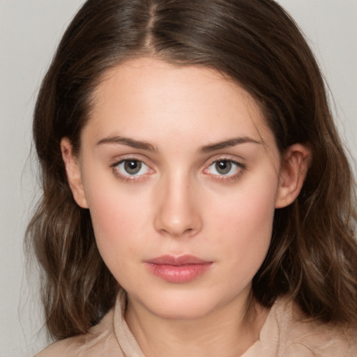 Neutral white young-adult female with medium  brown hair and brown eyes