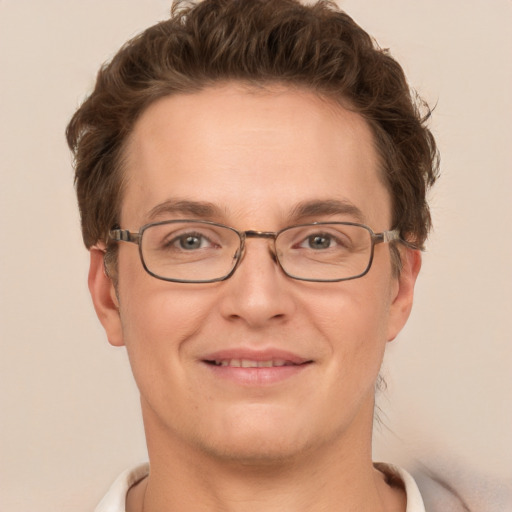 Joyful white adult male with short  brown hair and grey eyes