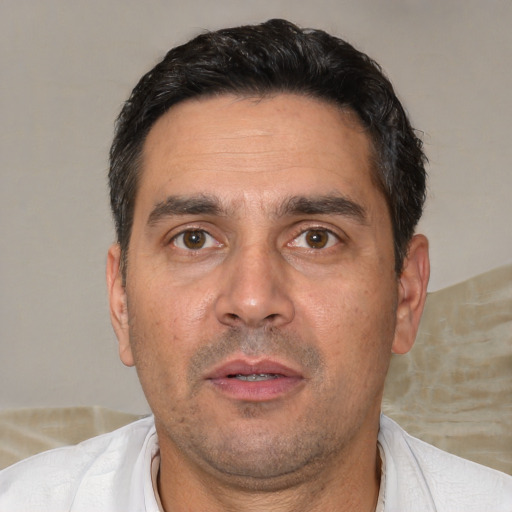Neutral white adult male with short  black hair and brown eyes