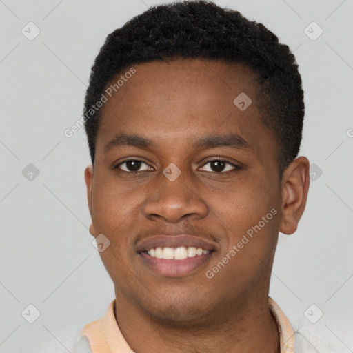 Joyful latino young-adult male with short  brown hair and brown eyes