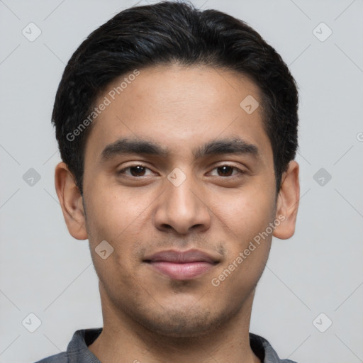 Joyful latino young-adult male with short  black hair and brown eyes