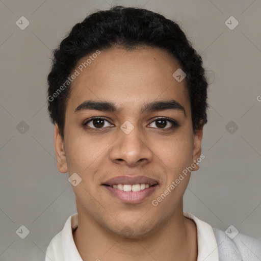 Joyful latino young-adult male with short  brown hair and brown eyes