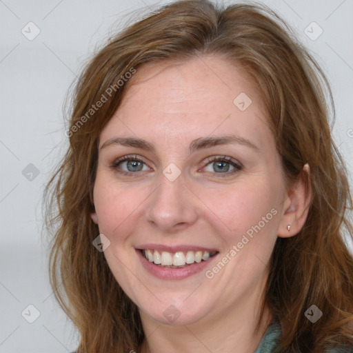 Joyful white young-adult female with long  brown hair and blue eyes