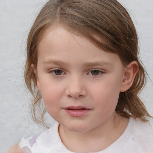 Joyful white child female with medium  brown hair and grey eyes