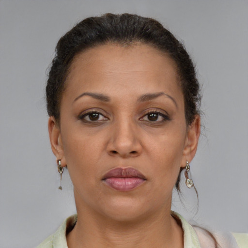 Neutral latino adult female with short  brown hair and brown eyes