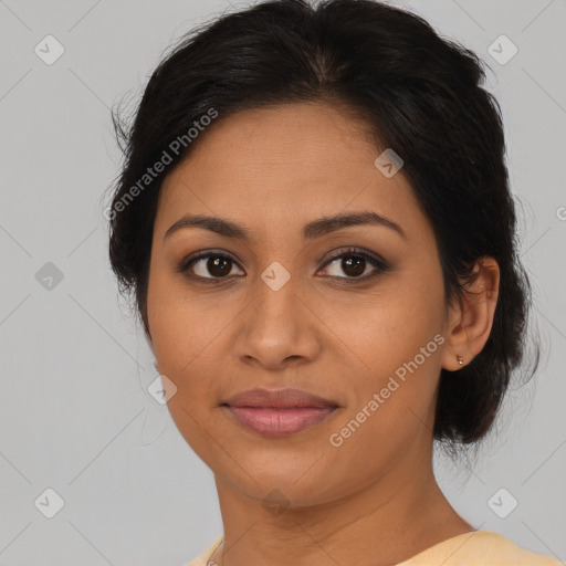 Joyful latino young-adult female with medium  brown hair and brown eyes