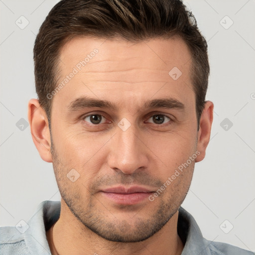 Joyful white young-adult male with short  brown hair and brown eyes