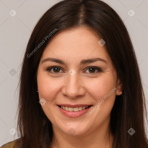 Joyful white young-adult female with long  brown hair and brown eyes