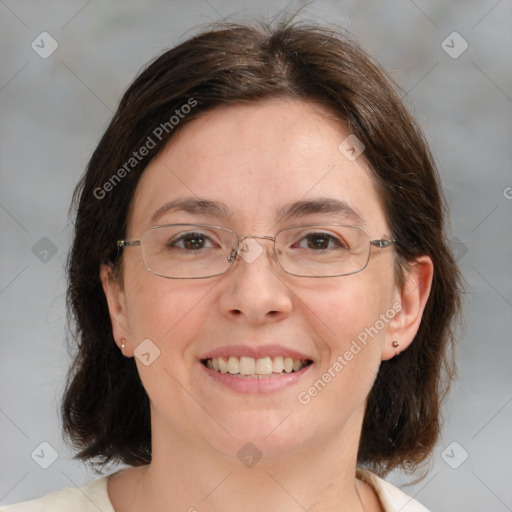 Joyful white adult female with medium  brown hair and green eyes