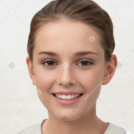 Joyful white child female with short  brown hair and brown eyes