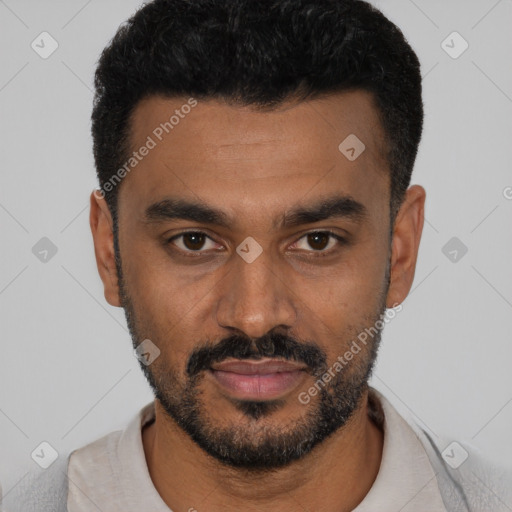 Joyful black young-adult male with short  black hair and brown eyes