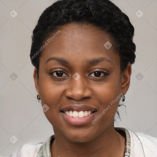 Joyful black young-adult female with short  brown hair and brown eyes